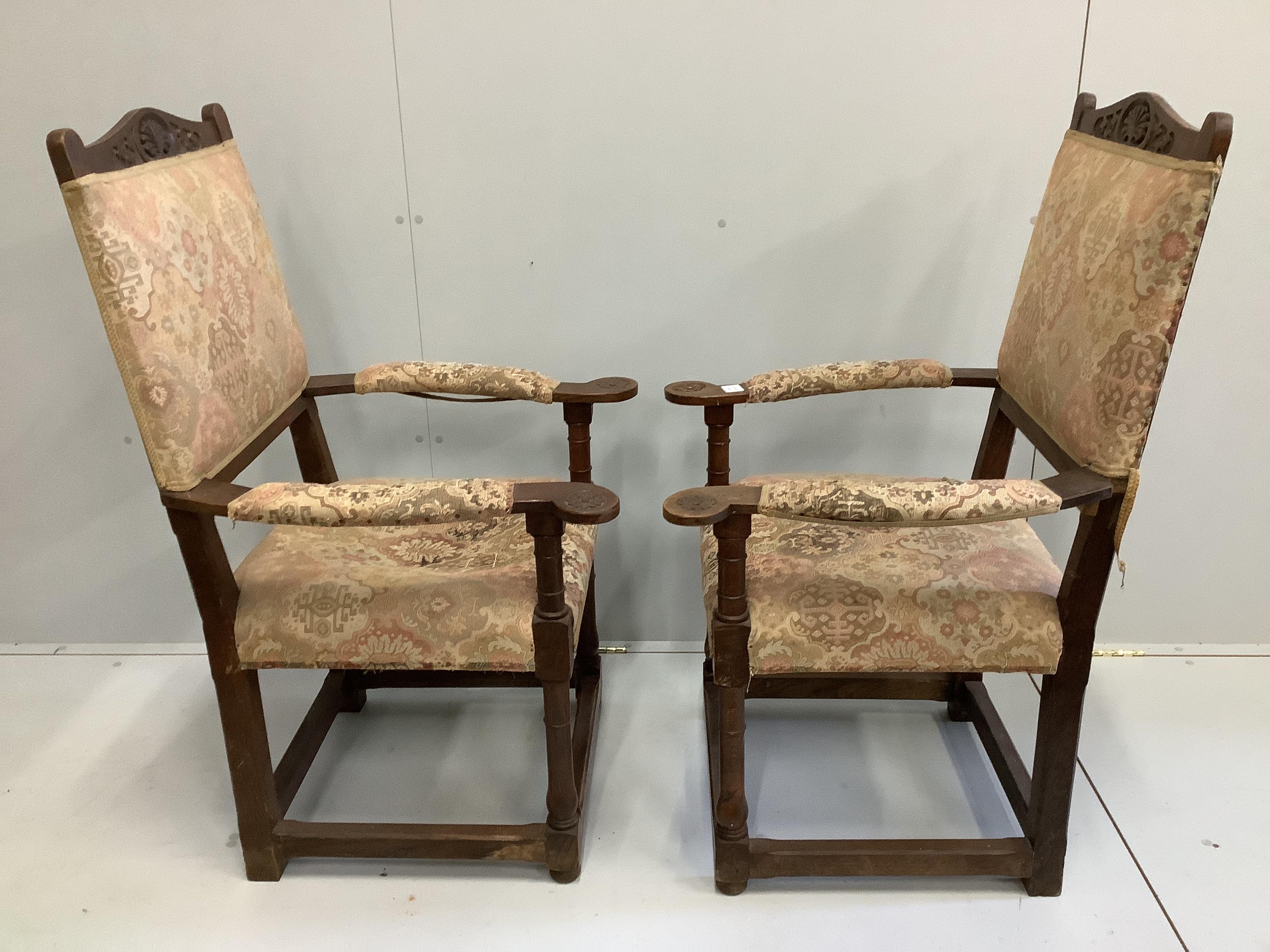 A pair of oak elbow chairs, width 64cm, depth 60cm, height 114cm